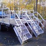 Retrofit truck bed with aluminum railings and stairs